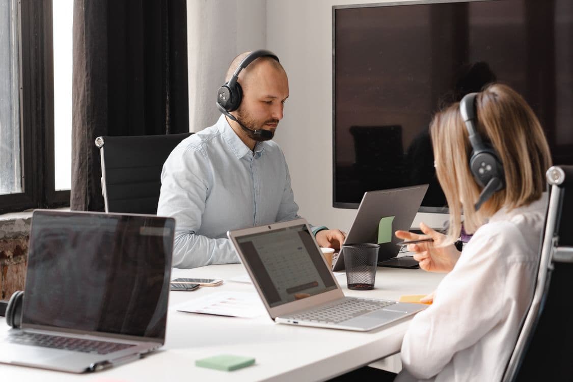 Professional consultation scene with a person reviewing project notes