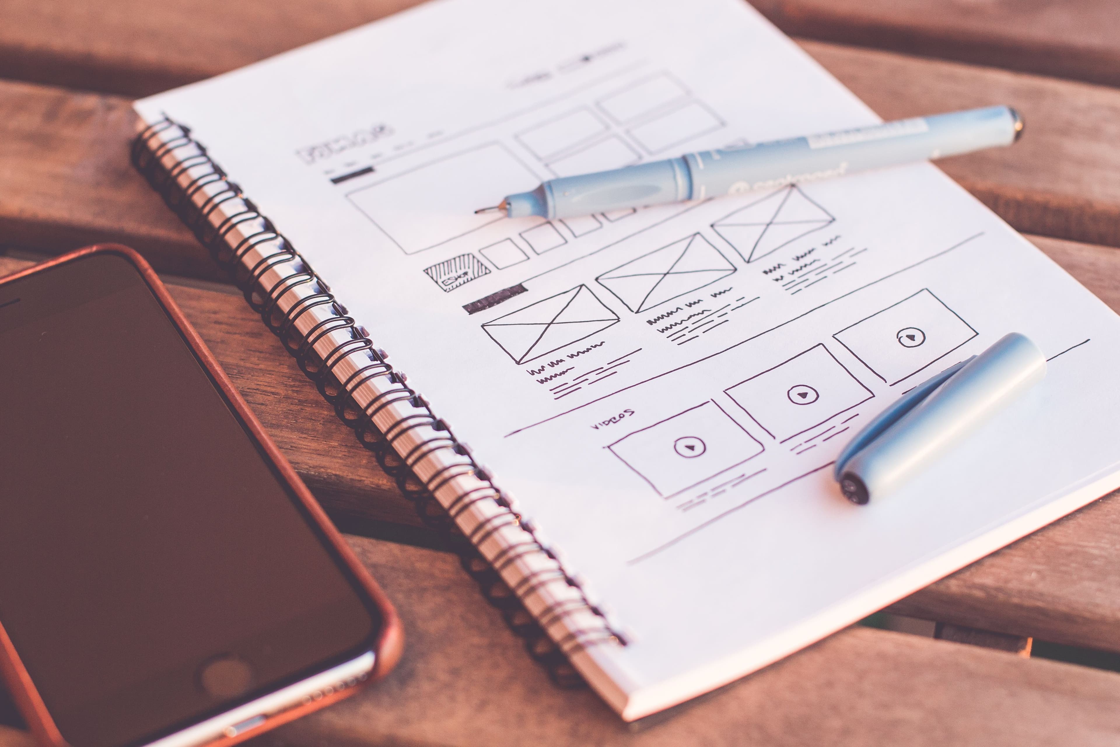 Product interface design and wireframing on a creative desk